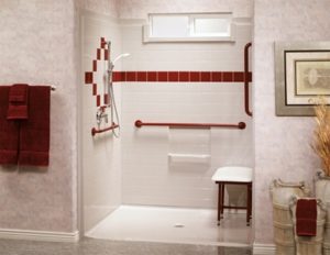 Wheelchair accessible bathroom shower with red colour accent tiling.